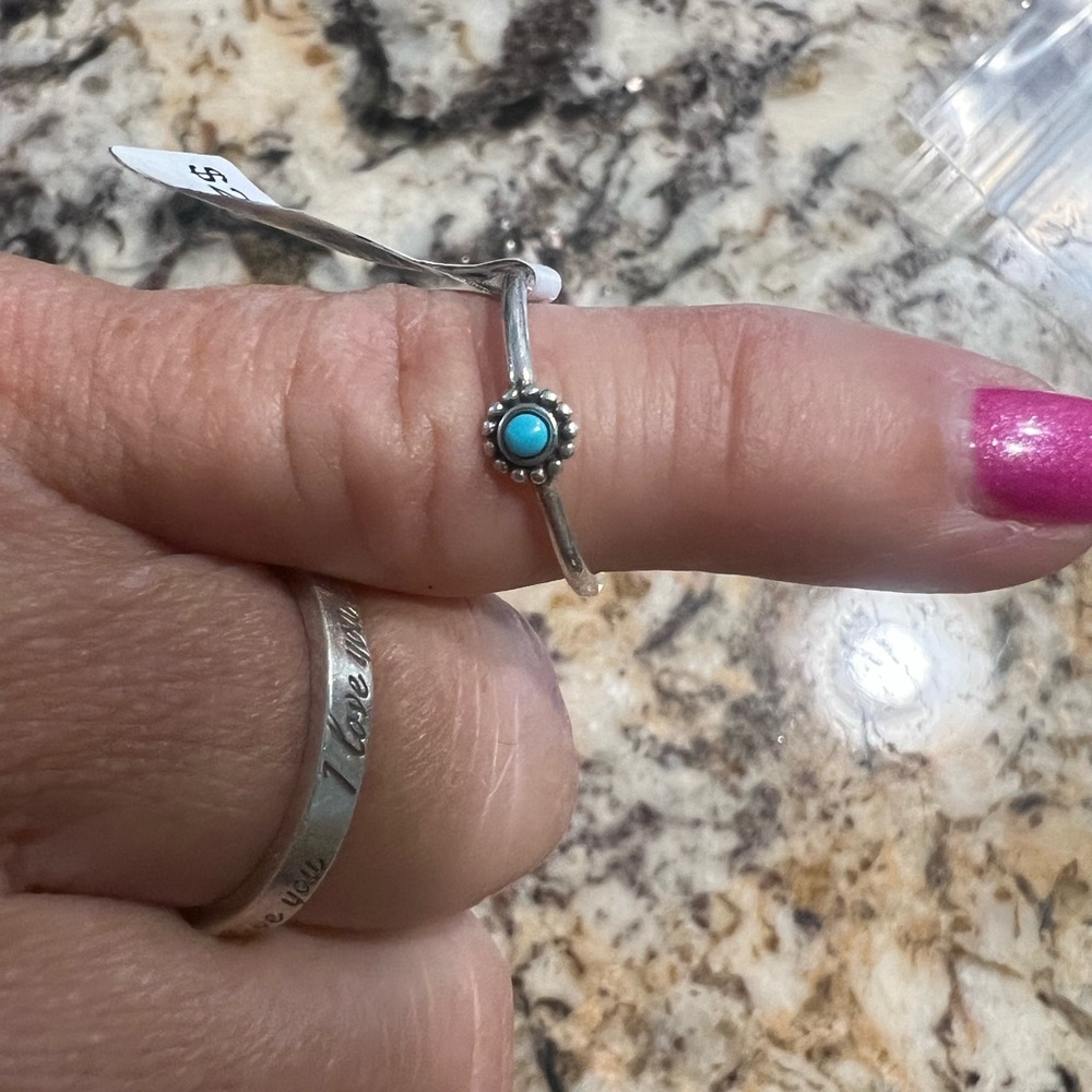 Silver Ring .925 round dainty ladies ring.
Round design with blue center stone